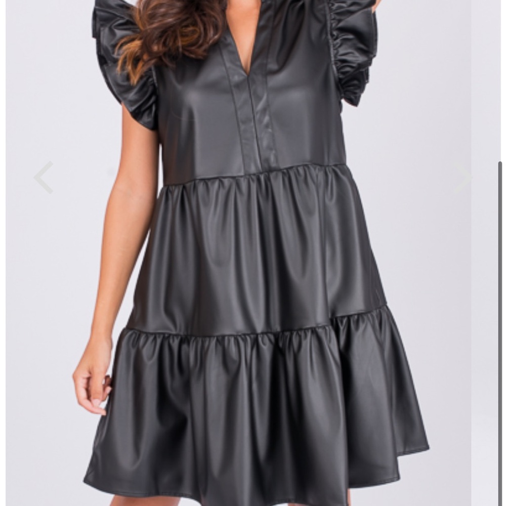 Black faux leather dress with ruffle sleeve. NWT